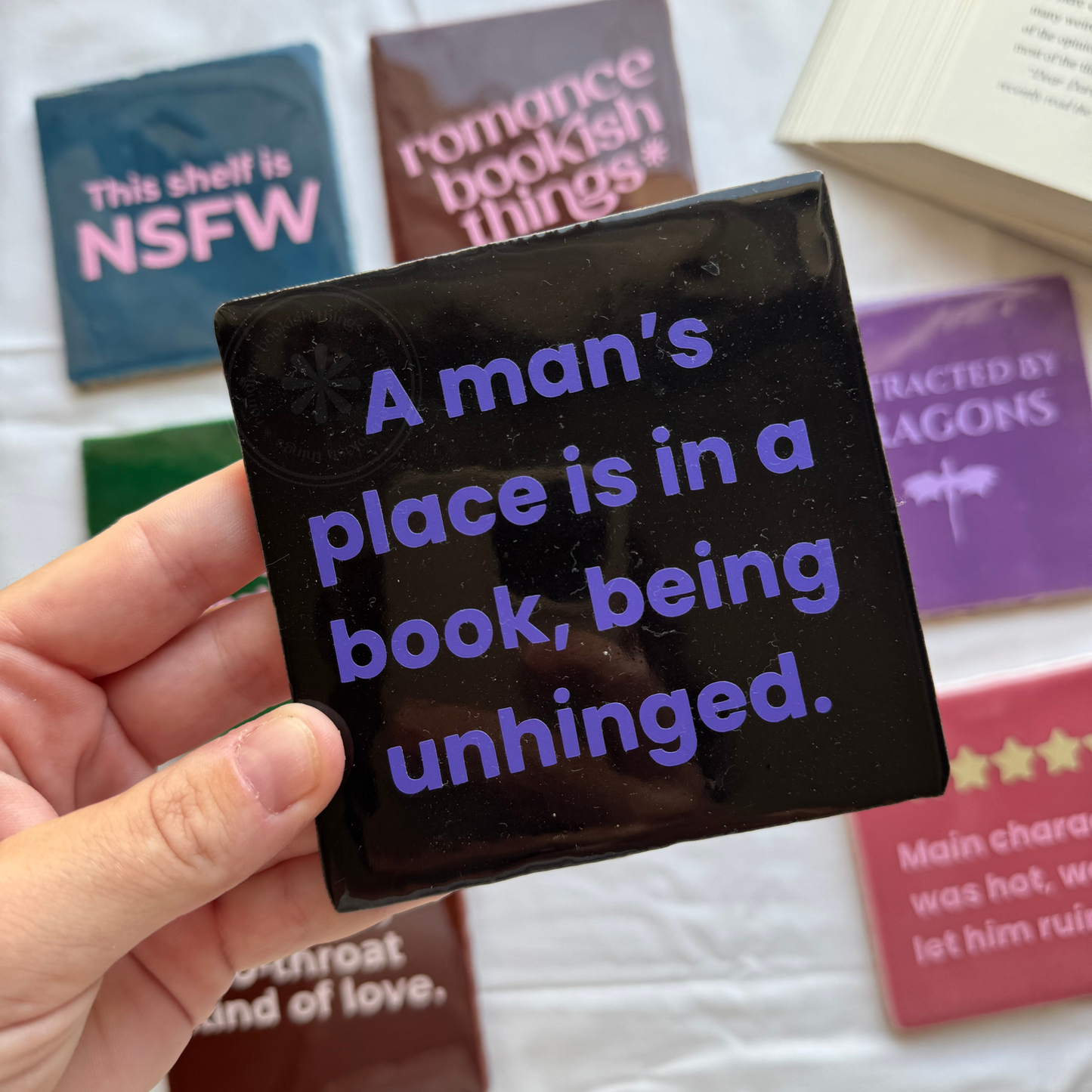 A Man’s Place Is in a Book Tile
