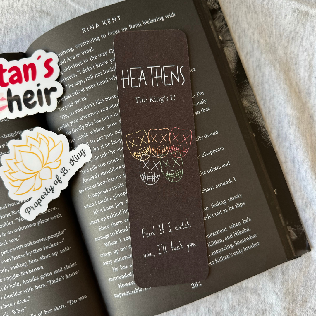 Dark Chocolate Colored Hoodie with the text Heathens, The King's U and a design with all 5 Masked Heathens ben. Based on the Legacy of Gods series by Rina Kent