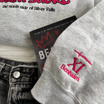 Xi Benhaim North Shore embroidered sweatshirt close up flat lay inspired by Heartless Beloved from Lola King