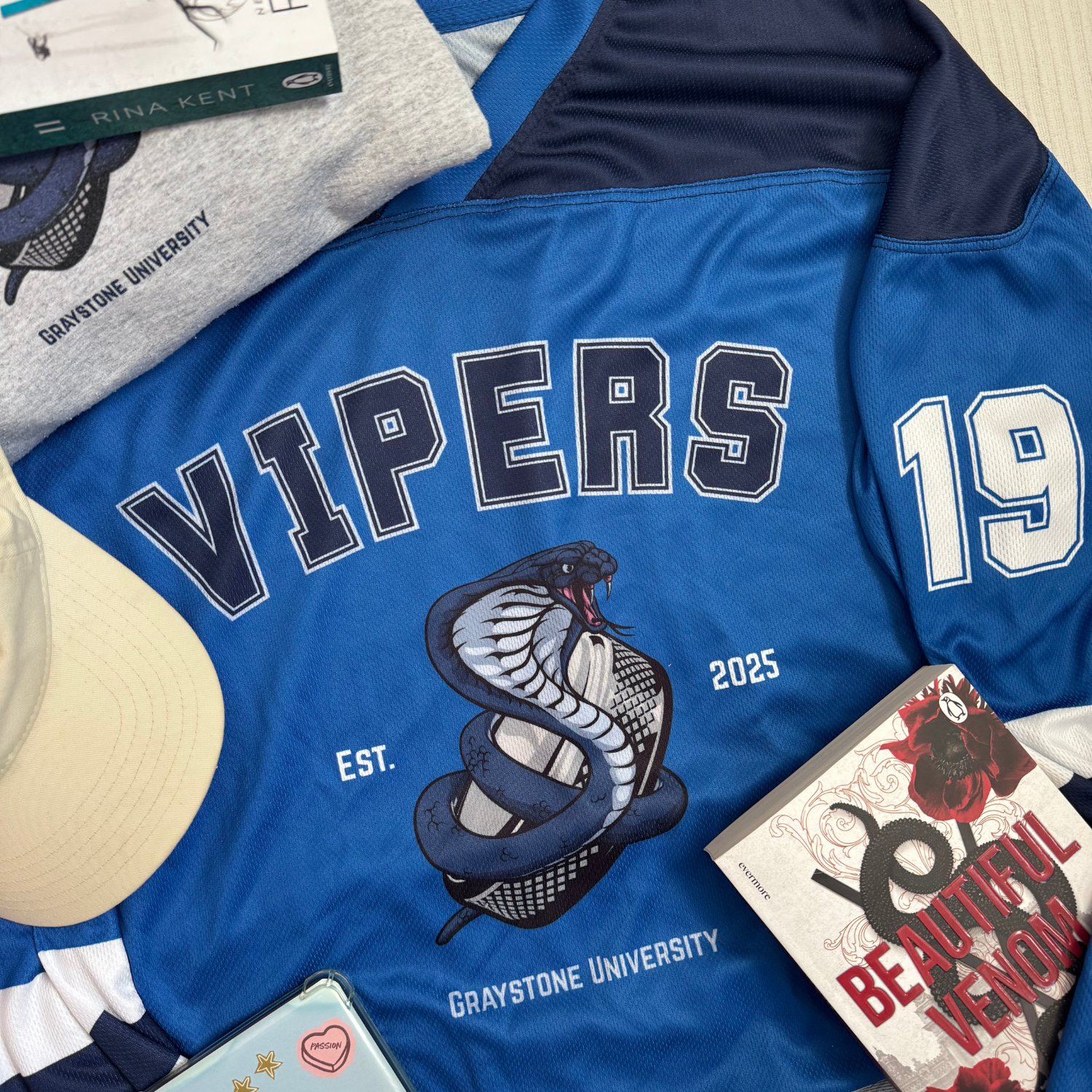 Rina Kent Vipers hockey jersey flat lay inspired by the Vipers series by Rina Kent