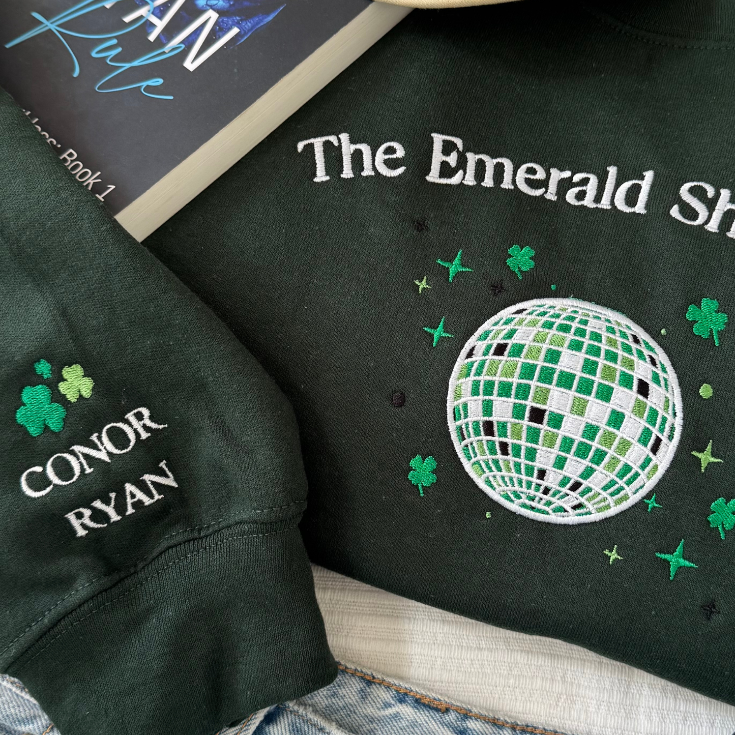 Emerald Shamrock embroidered sweatshirt flat lay detail Ryan brothers Conor