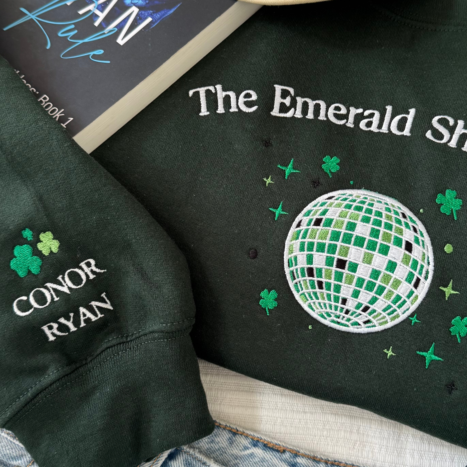 Emerald Shamrock embroidered sweatshirt flat lay detail Ryan brothers Conor